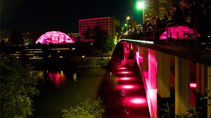 Visitors gather and marvel at the breath-taking lighting effects at Plaza del Milenio