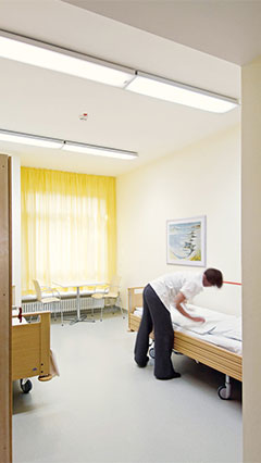 Patient room at the psychiatric clinic lit by Philips