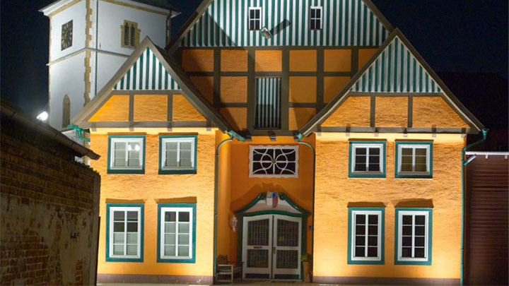 Facade of a building at the historic Ritberg illuminated by Philips