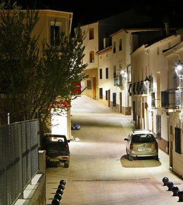 A narrow street at the town of Salobre well lit with Philips street lighting