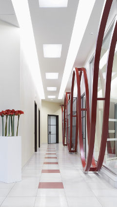 A corridor at AB Group office, Italy, lit with Philips office lighting
