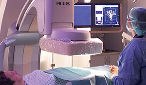 Doctors are examining a patient in an X-ray machine