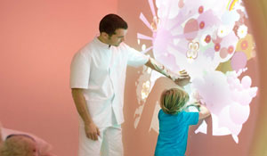 Doctor and child play with the light
